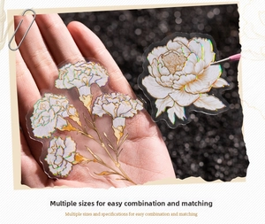 Macro shot of holographic PET flower stickers featuring carnations and peonies