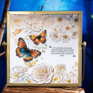 3D paper carving art with colorful butterflies and white floral gold-edged flowers in frame