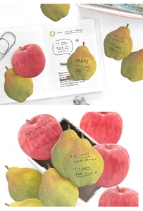 Detail showing realistic fruit-shaped sticky notes with textured apple and pear designs