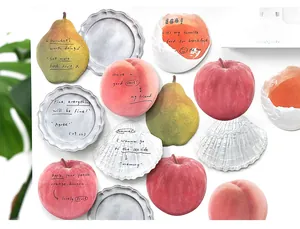 Artistic fruit-shaped sticky notes featuring apple and peach designs for daily memos