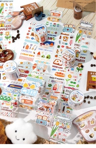 Close-up of decorative washi tape set featuring dessert and cat patterns for scrapbooking