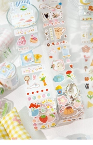 Detailed close-up of Forest Fairytale PET stickers with animals, flowers, and glitter finish
