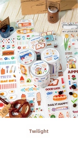 Flat lay of four cartoon washi tape rolls featuring dessert and bakery illustrations