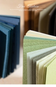 Macro detail of textured acid-free paper sheets with fine vintage fiber grain and embossed finish