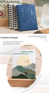Macro view of blue textured spiral notebook cover with artistic collage card detail