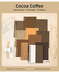 Flat lay of vintage brown specialty paper sheets and mini spiral notebook for journaling