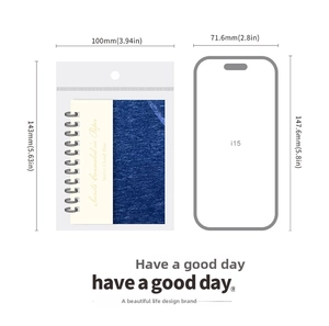 Detail view showing a starry cloud blue notebook with size reference and packaging