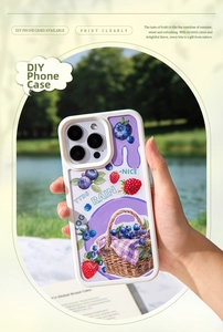 Outdoor shot of a berry-themed iPhone case with strawberry patterns and custom DIY design