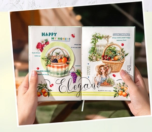 Detail of berry themed stickers on scrapbook featuring fruits and floral patterns