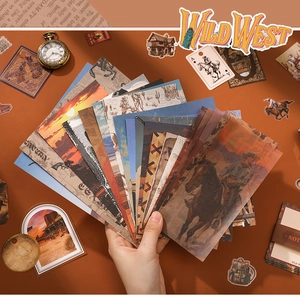 Macro shot of Wild West vintage junk journal paper kit with cowboy and desert motifs