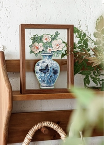 Detail of 3D floral PET sticker with blue porcelain vase and butterfly on clear panel