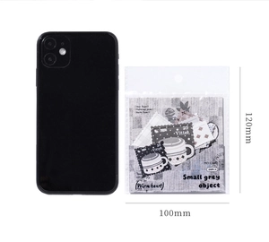 Detail of 20pcs vintage relief stamp stickers next to a phone for size reference