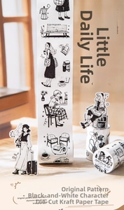 Macro detail of die-cut washi tape featuring black and white hand-drawn character illustrations