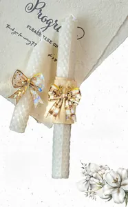 Gros plan d'autocollants nœuds en PET effet laser sur bougie pour scrapbooking DIY