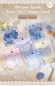 Macro detail of Blossom Sparks PET lace stickers with glitter sand texture on white fabric
