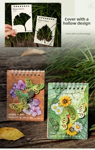 Close-up of laser-cut leaf pattern on spiral notebook cover with outdoor natural light