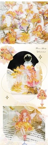 Macro detail of transparent PET floral fairy stickers for DIY journal decoration