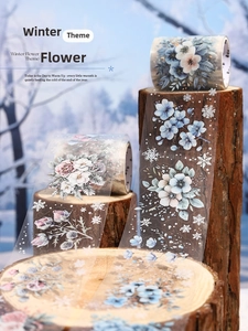 Close-up of winter flower PET decorative tape with hand-drawn floral patterns on wood
