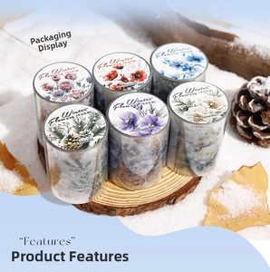 Macro view of Winter Flowers PET tape rolls set on wood slices with snowy scene