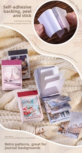 Macro shot of Winter Scenery vintage sticker book for scrapbooking on knit background