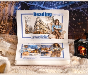 Macro detail of winter scenery stickers and reader illustrations on dot grid paper