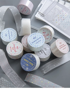 Detailed close-up of colorful PET masking tape rolls with grid and glitter patterns