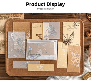 Close-up of vintage butterfly scrapbooking paper set with vellum and kraft textures