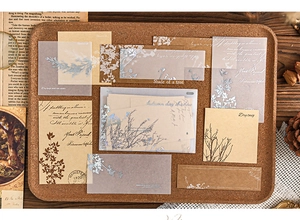 Macro detail of retro botanical collage stickers with parchment and kraft paper textures
