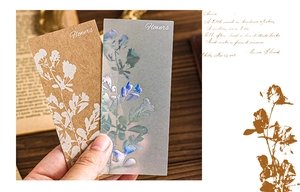 Close-up of vintage floral scrapbooking cards with iridescent finish and paper texture