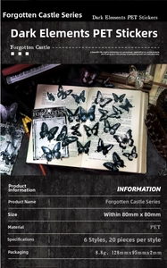 Detail of dark gothic butterfly PET stickers arranged on vintage books and old piano keys