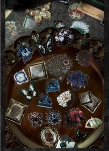 Gothic castle aesthetic stickers with vintage frames and butterflies on a dark wood tray