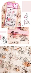 Close-up of vintage PET stickers and pink standing notepad for DIY scrapbooking decor