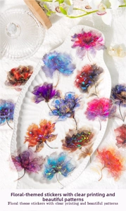 Macro detail of translucent holographic floral PET stickers for scrapbooking decoration