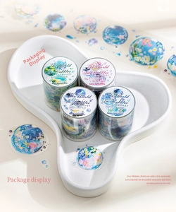 Macro view of four PET washi tape rolls featuring dreamy bubble illustrations and vignettes