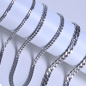 925 silver Cuban link chains in five different widths shown on a cylindrical display