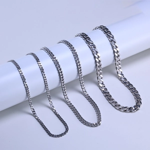 Detail showing five different widths of polished 925 silver Cuban link chains in a row