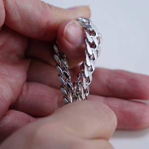 Macro shot of 925 silver Cuban link chain with a high polished mirror finish for men