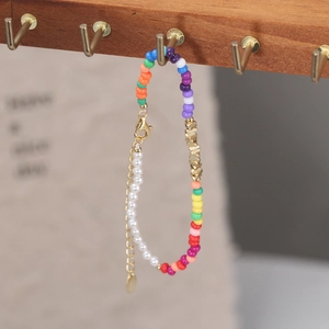 Close-up of colorful beaded bracelet with 925 silver accents and gold-plated clasp