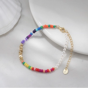 Close-up of S925 sterling silver tag on a colorful bead and pearl spliced bracelet