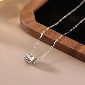 Macro shot of S925 sterling silver honeycomb cylinder pendant with hallmark detail
