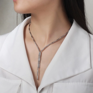 Close-up of S925 sterling silver Y-shaped necklace with elegant bamboo textures