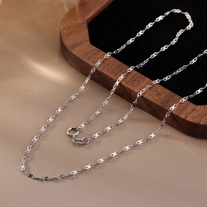 S925 sterling silver minimalist link chain necklace on luxury dark jewelry tray