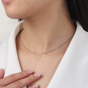 Elegant 925 sterling silver flat figure-8 link chain necklace worn by a model