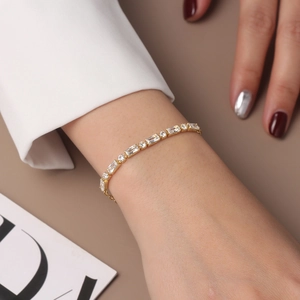 Elegant gold S925 silver bracelet featuring emerald-cut and round zircon stones