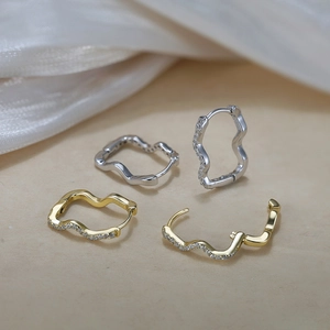 Elegant S925 sterling silver wave hoop earrings with zircon stones in gold and silver