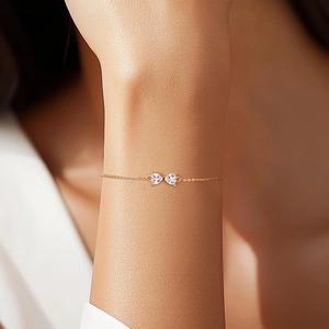 Minimalist 925 silver gold bracelet with dual heart gemstone bow charm on wrist