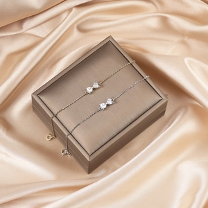 Elegant 925 silver bow bracelets in gold and silver finish with heart-shaped cubic zirconia
