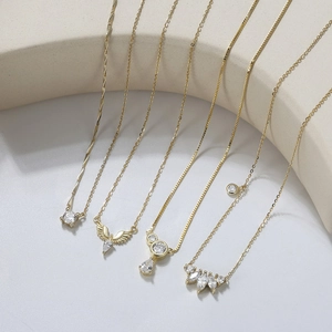 Detailed display of five gold plated S925 silver necklaces with marquise and zircon pendants
