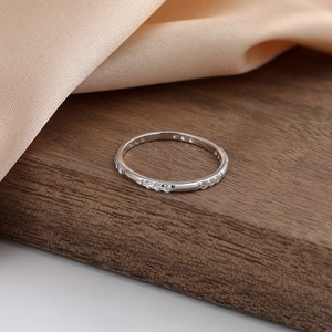 Detailed view of S925 sterling silver band ring set with small round zircon stones