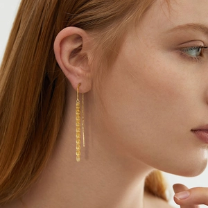 Elegant gold-plated fan-shaped fishtail drop earrings with long tassel threads on model